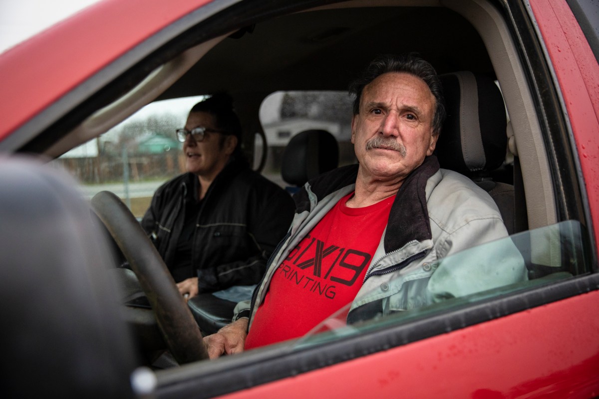 Joseph Felice (right) and Kim Payne wait in line to receive food at the Trinity County Food Bank distribution at the Trinity County Fairgrounds on Feb. 8, 2023. Photo by Martin do Nascimento, CalMatters