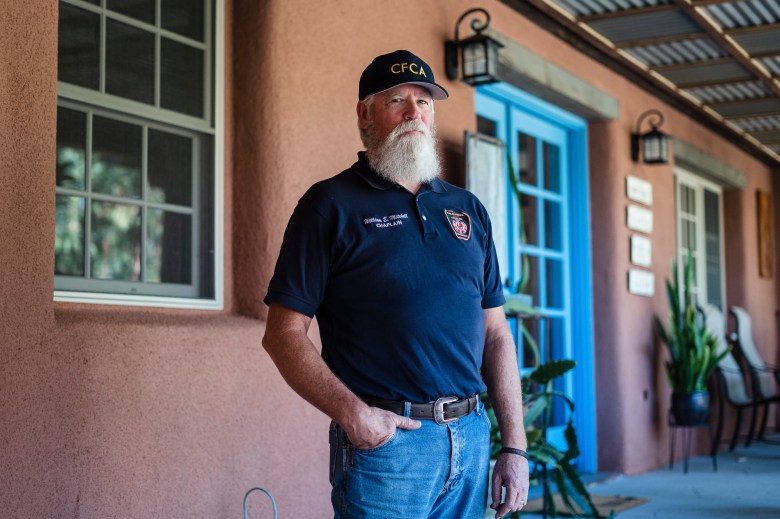 William Mitchell at his home in Lakeside, California on February 10, 2022. Mitchell became a fire chaplain serving Cal Fire after his son a Cal Fire Captain, Ryan Mitchell took his own life. Photo by Ariana Drehsler for CalMatters
